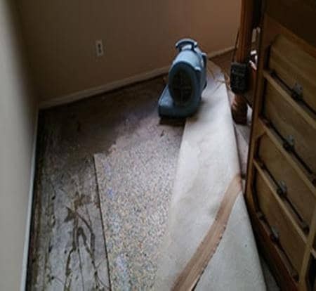 Water damage drying equipment on a floor