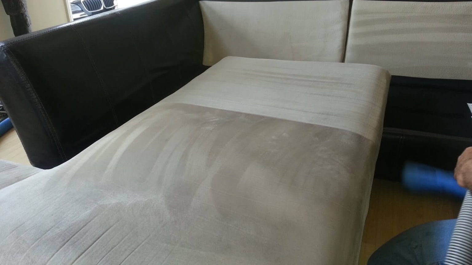 Upholstery steam cleaning on a sofa