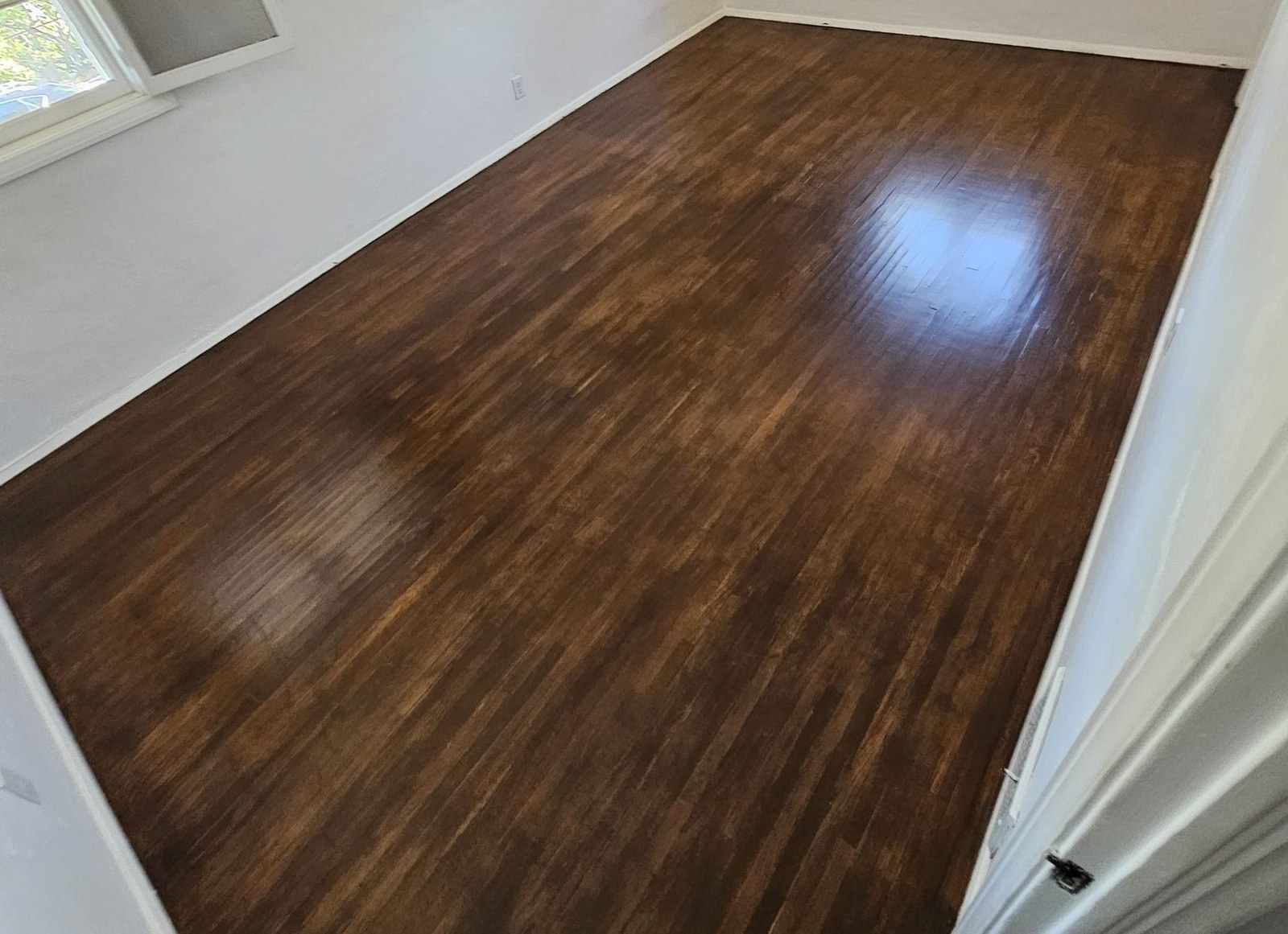 Cleaning a wood floor with professional equipment